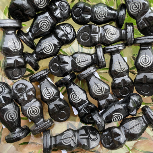 Black onyx goddess statues with spiral designs symbolizing strength and femininity