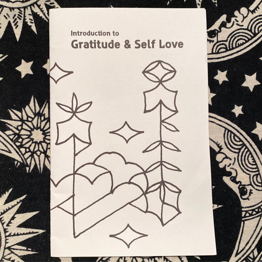 Front cover of a booklet titled Introduction to Gratitude & Self Love with simple line art illustrations on a star-patterned background